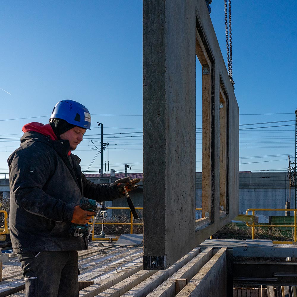 Precast concrete wall is pulled out of the toaster